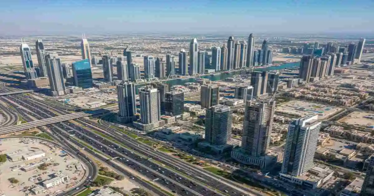 Aerial view of Dubai Creek Harbour waterfront featuring the 2026 skyline and upcoming Blue Line Metro corridor
